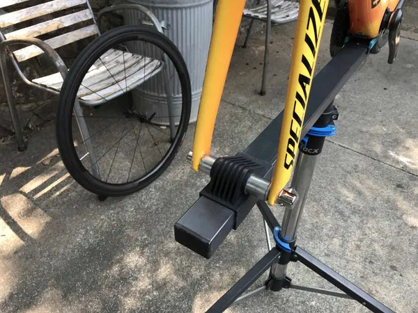 Quick release bike fork mounted on a bike stand.